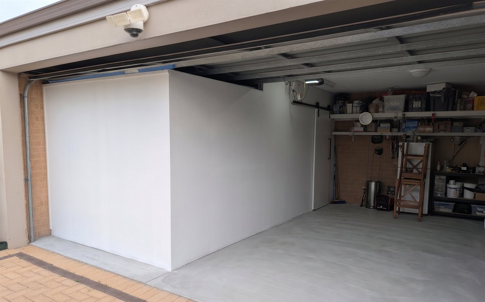 The new room taking shape inside one side of the garage.