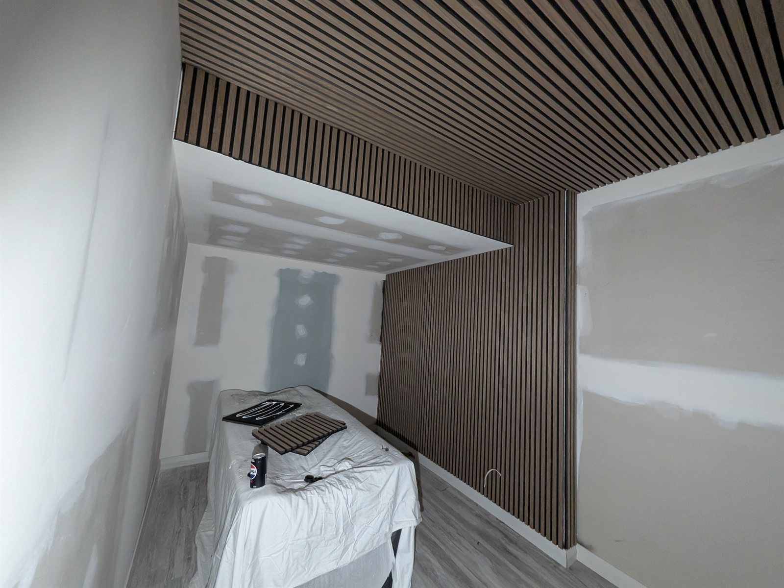 The timber feature panels being fitted before painting and final installation.
